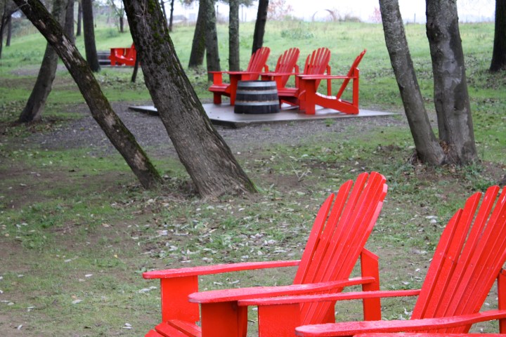 IMG_1494 Truett-Hurst - Vibrant red chairs next to Dry Creek